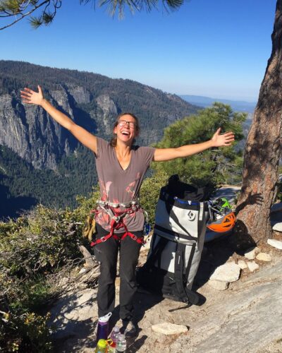 Lauren DeLauney Miller celebrating at the top of El Cap in Yosemite